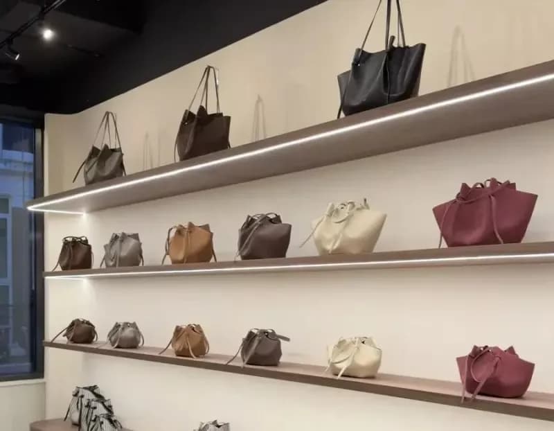Retail display lit by focused ceiling spotlights