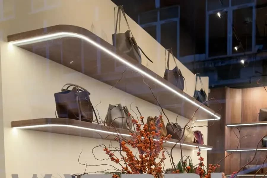 Retail shelving lit by concealed linear LED