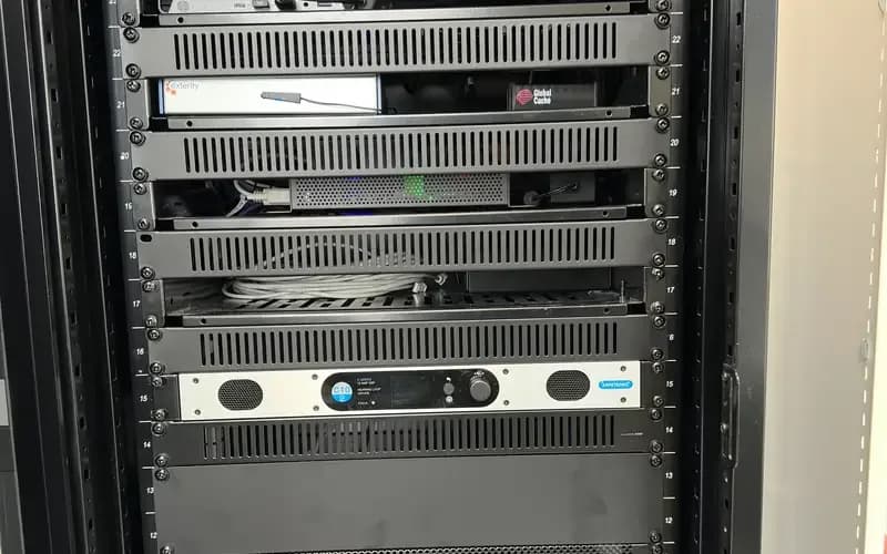 Engineer servicing an AV rack